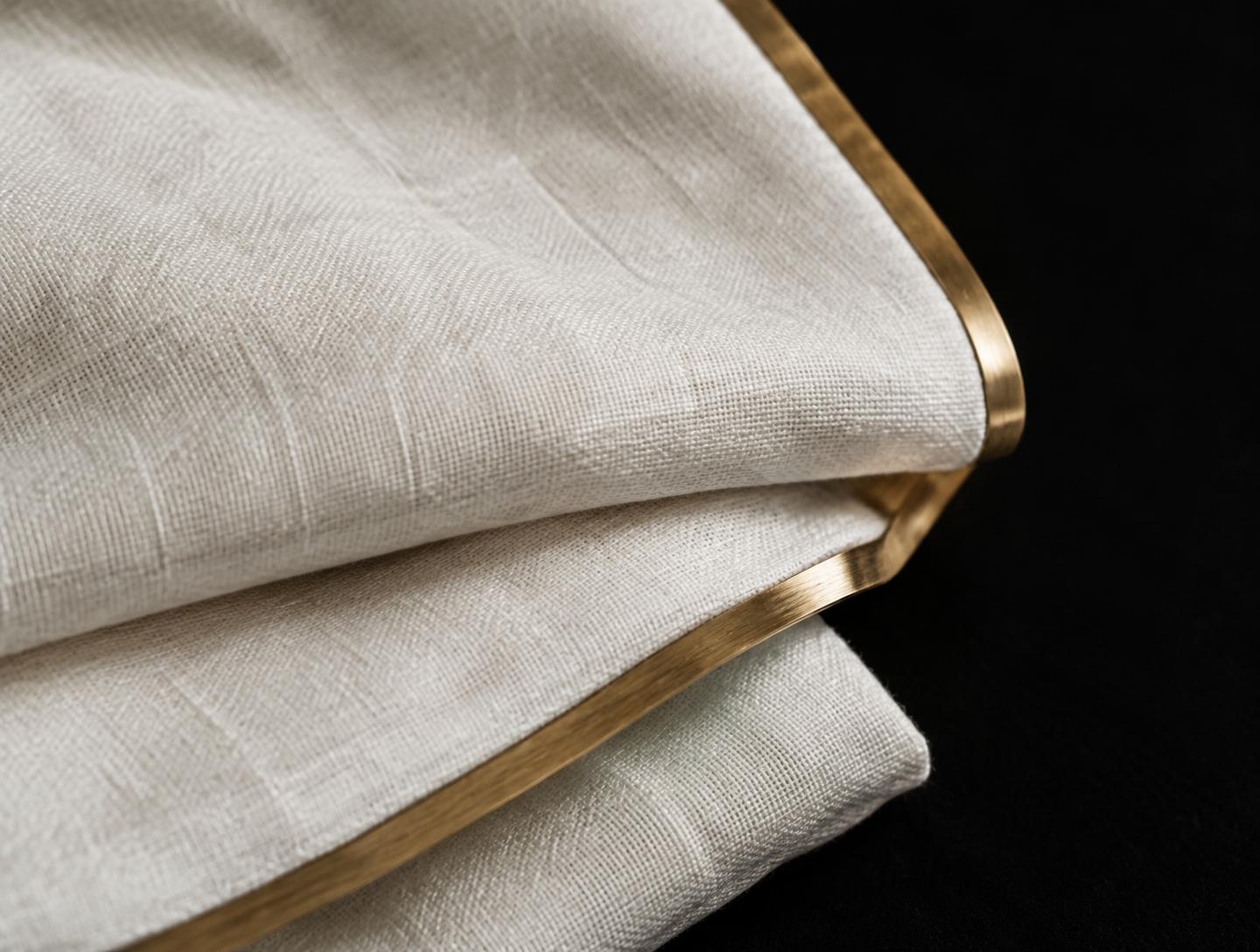 Editorial still life of linen and a gold edge